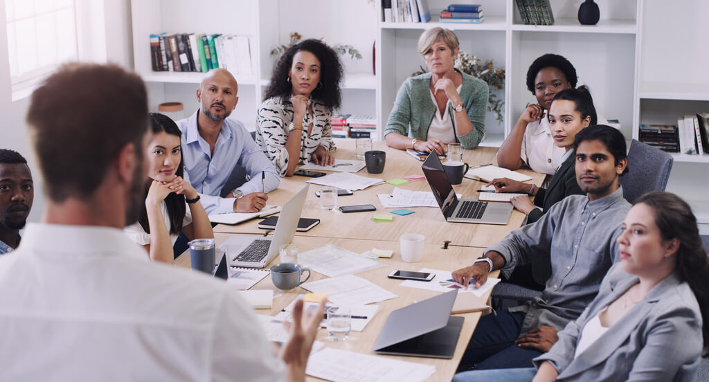 A photo of nonprofit professionals gathered around a table