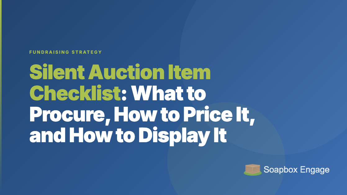 Silent auction display tables with items and bid sheets at a nonprofit fundraising event